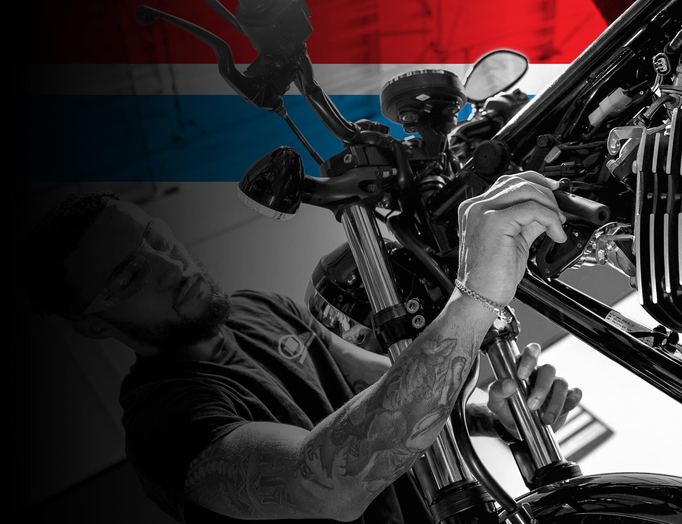 UTI trade school graduate wearing a black cap and gown with honor cords, smiling at commencement ceremony.