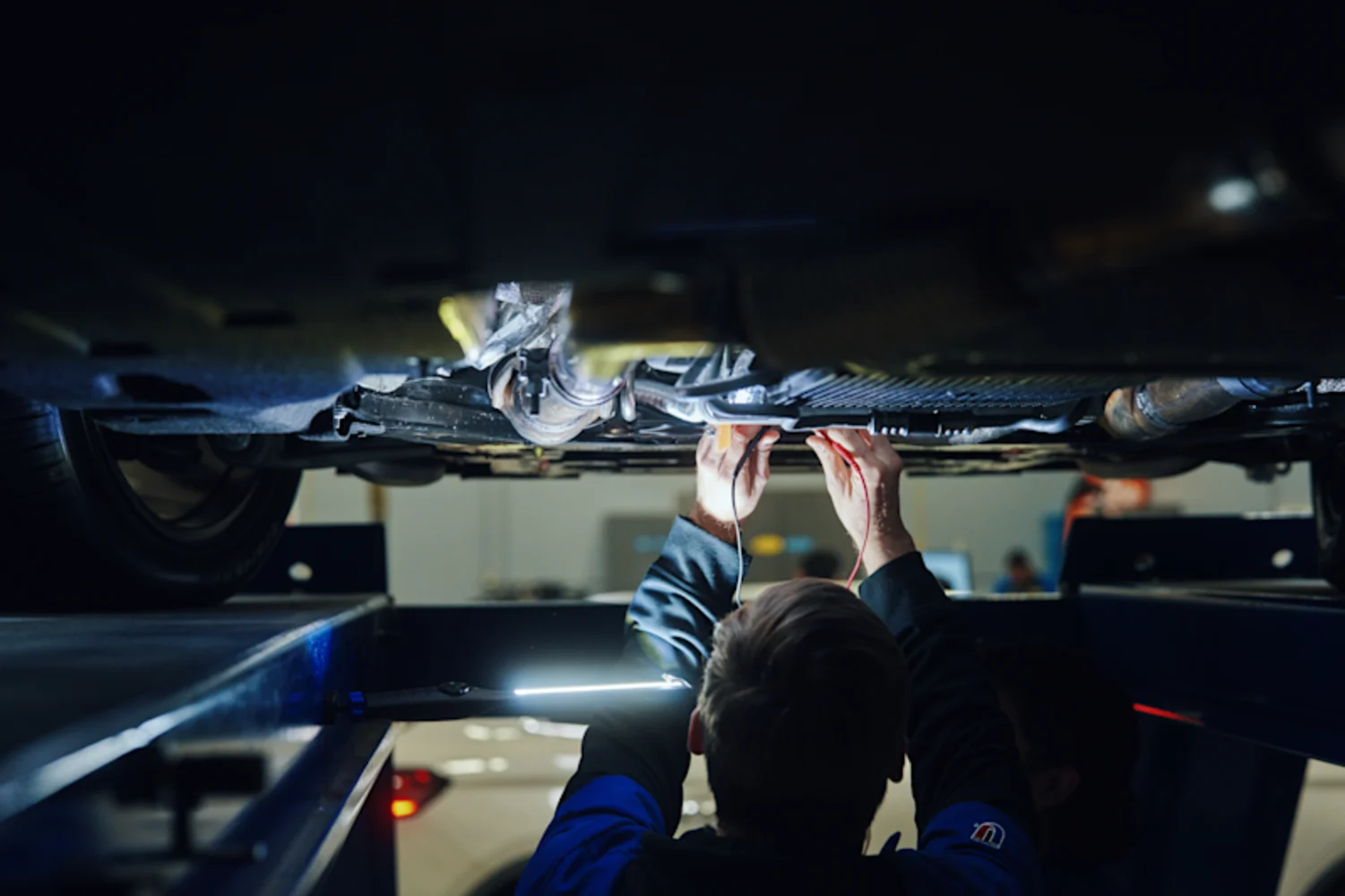 UTI student working on car